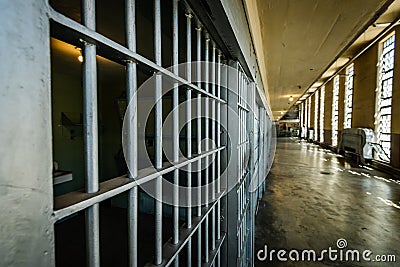 Looking Down Prison Cell Block at Bars Stock Photo