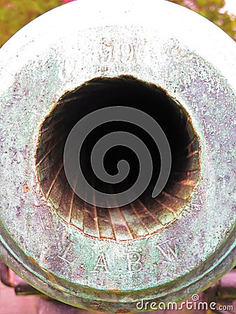 Looking down an old ribbed cannon bore Stock Photo