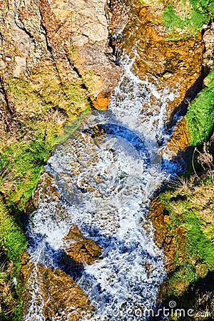 Looking down on river of cascading waters Stock Photo