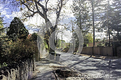 Looking Down the Street with Fences on each side. Stock Photo