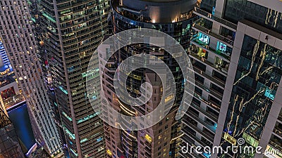 Looking down view perspective on night highlighted luxury Dubai Marina skyscrapers night timelapse, Dubai, United Arab Editorial Stock Photo