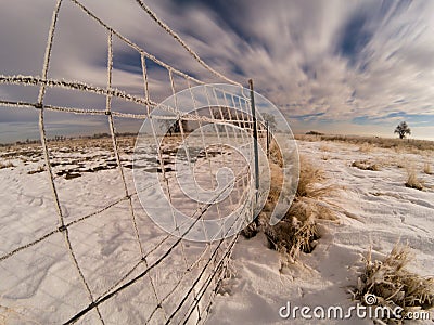 Fence Frozen in Hoar Frost During Colorado Winter Stock Photo