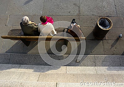 Women tourists sitting on bench from above. Editorial Stock Photo