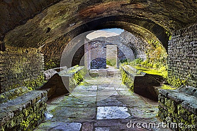 Looking at the exit inside the thermal`s mithraeum in archaeological excavations in Ostia Antica - Rome Stock Photo