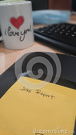 looking at jobs report book on office desk. Stock Photo