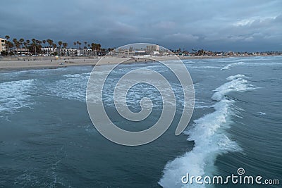 Looking at long surf coming to Missin Beach Stock Photo