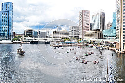 Looking Out Over the Baltimore Inner Harbor Where Tourists Ride in Pirate Themed Paddle Boats Editorial Stock Photo