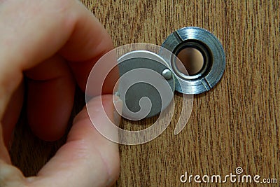 Looking through peephole Stock Photo