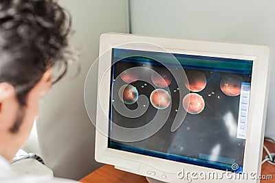 Looking at a retina scan Stock Photo