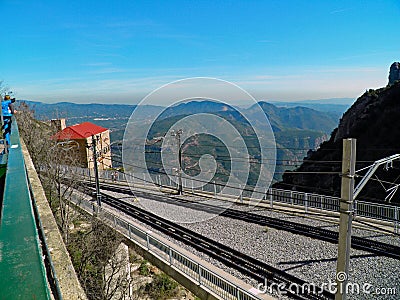 Looking at the trainstation and the surrounding mountains Stock Photo