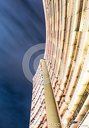Long exposure photograph looking up at building with long exposure of clouds Editorial Stock Photo