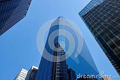 Looking up at buildings in the Lower Manhattan Financial District. In the center is 33 Whitehall Street, the Broad Financial Editorial Stock Photo