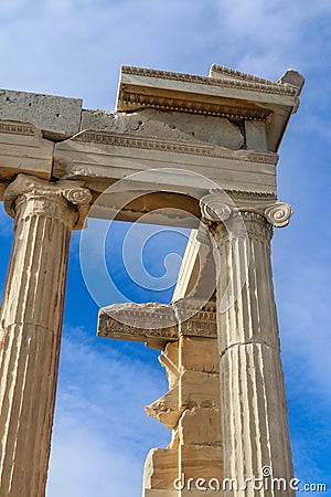 Looking up at detail of reconstructed columns on the Parthenon on the Accropolis in Athens Greece with beautiful blue sky with Stock Photo