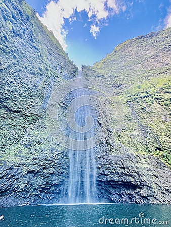 Skyward Cascade: Hanakapiai Falls in the Heart of Na Pali, Kauai Stock Photo