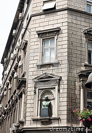 See the exterior of a city corner building in Belgrade, Serbia, with statue in honor of Nikola Spacich. Editorial Stock Photo