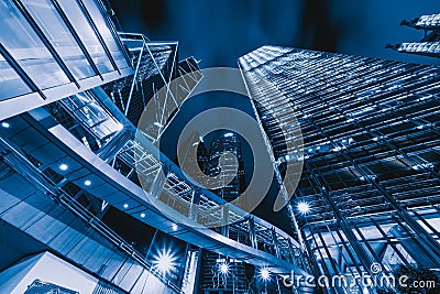 Looking up at modern office buildings. Financial district and business centers in smart city for technology background. Skyscraper Stock Photo