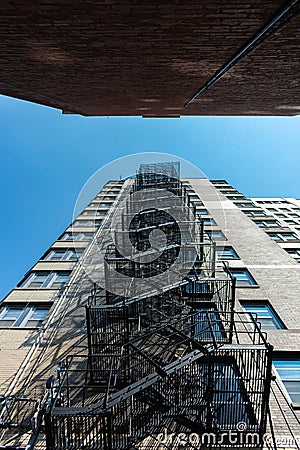 Looking Upwards at a Fire Escape in a tight Alley in Chicago Stock Photo