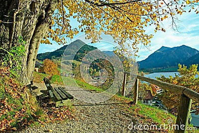 Lookout point at schliersee with bench in autumnal landscape Stock Photo