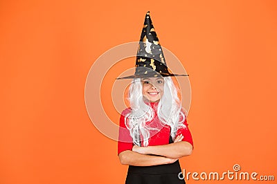 Looks perfect. trick or treat. supernatural charmer gray hair. kid enchantress orange background. happy halloween. magic Stock Photo