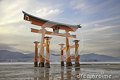 Looming vermilion tori (Shinto gate)Miyajima Island, Japan Stock Photo