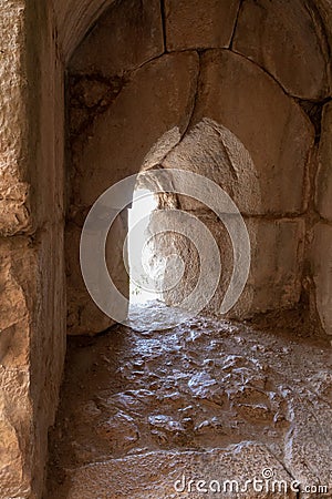 A loophole in the wall near the secret exit near the main gate to the ruins of the medieval fortress of Nimrod - Qalaat al- Stock Photo