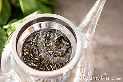 Loose leaves green tea in a teapot Stock Photo