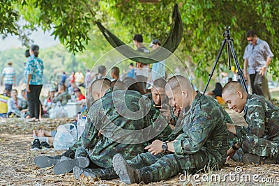 LOPBURI THAILAND, MARCH 23, 2019 : Thai cadets relax after completing the parachute training at Ban Tha Duea Drop Zone on March 23 Editorial Stock Photo