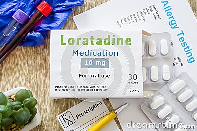 Loratadine medication or allergy drug concept photo. On doctor table is pack with words `Loratadine medication` and pills for tre Stock Photo