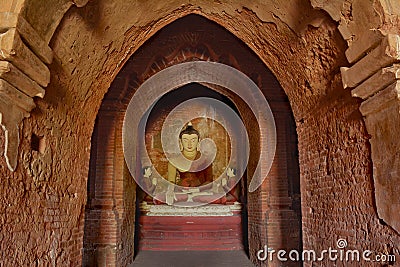 Lord Buddha sculpture sitting in meditation inside ancient temple in Bagan, Myanmar. Stock Photo