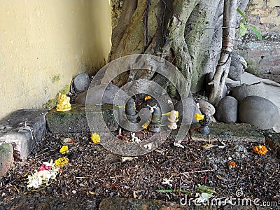 Hindu Believes - Siva Lingam with Fengsui laughing buddha Stock Photo