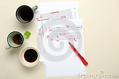 Top view of lot of cups of coffee and paper script, red marks.Concept of checking mistakes in the text Stock Photo