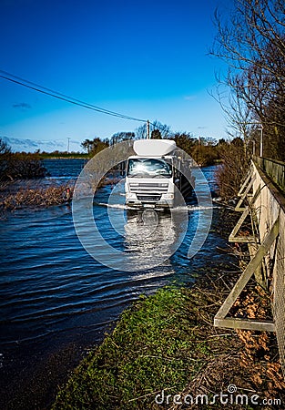 Lorry driving through flood water Editorial Stock Photo