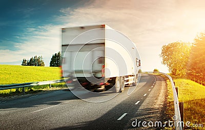 Lorry moving on sunny evening Editorial Stock Photo