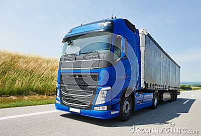Lorry with trailer driving on highway Stock Photo
