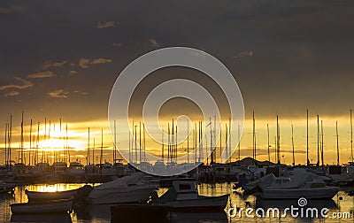Los Alcazares, Spain. The seaport during an amazing sunrise with sun reflection on water Editorial Stock Photo