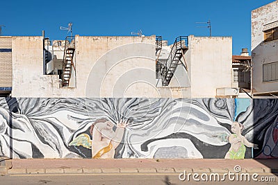 LOS ALCAZARES, SPAIN - FEBRUARY 25, 2019 Graffiti on the walls in the streets of the small coastal town of Los Alcazares in the Editorial Stock Photo
