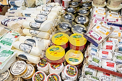 Packages of Assorted brands cheeses for sale Editorial Stock Photo