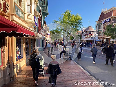 Families walking along the main street from the entrance to Universal Studios, Los Angeles, California Editorial Stock Photo