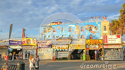 LOS ANGELES, CALIFORNIA, USA - AUGUST 25, 2015: wide shot of the vendors along the boardwalk at venice beach Editorial Stock Photo