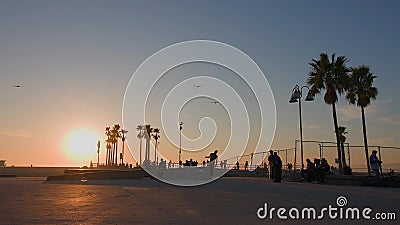 LOS ANGELES, CALIFORNIA, USA - December 10, 2020: Venice Ocean Beach skatepark. Silhouette of young jumping skateboarder Editorial Stock Photo