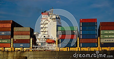 Shipping containers crowd the deck of an oceangoing ship. An important component of the global supply chain. Editorial Stock Photo