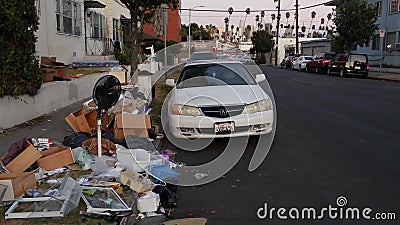 LOS ANGELES, CALIFORNIA, USA - 30 OCT 2019: Stack of waste on street roadside. Junk problem and recycling issues, pile of trash Editorial Stock Photo