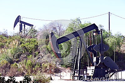 Los Angeles, California: view of The Inglewood Oil Field pumpjack located in the Baldwin Hills Editorial Stock Photo