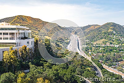 Los Angeles highway with trees and buildings Stock Photo