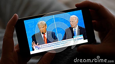 Los Angeles - 22 October 2020: Man Watching Trump vs Biden Presidential Debate on a Smartphone Editorial Stock Photo