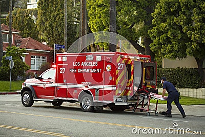 Los Angeles paramedic loads gurney into ambulance Editorial Stock Photo