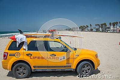 LOS ANGELES, USA - AUGUST 5, 2014 - lifeguard yellow car in venice beach landscape Editorial Stock Photo