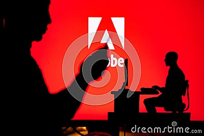 LOS ANGELES, USA, JANUARY 30, 2023: Adobe. The Intersection of Personal and Professional: Silhouette of Man and Web Developer Editorial Stock Photo