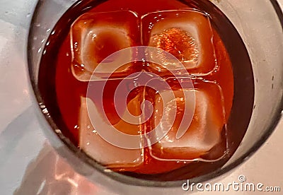 Detail of some ices cooling a glass with liquor. Stock Photo