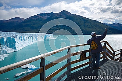 Lonely tourist takes selfie against Perito Moreno glacier and Lago Argentino lake Editorial Stock Photo